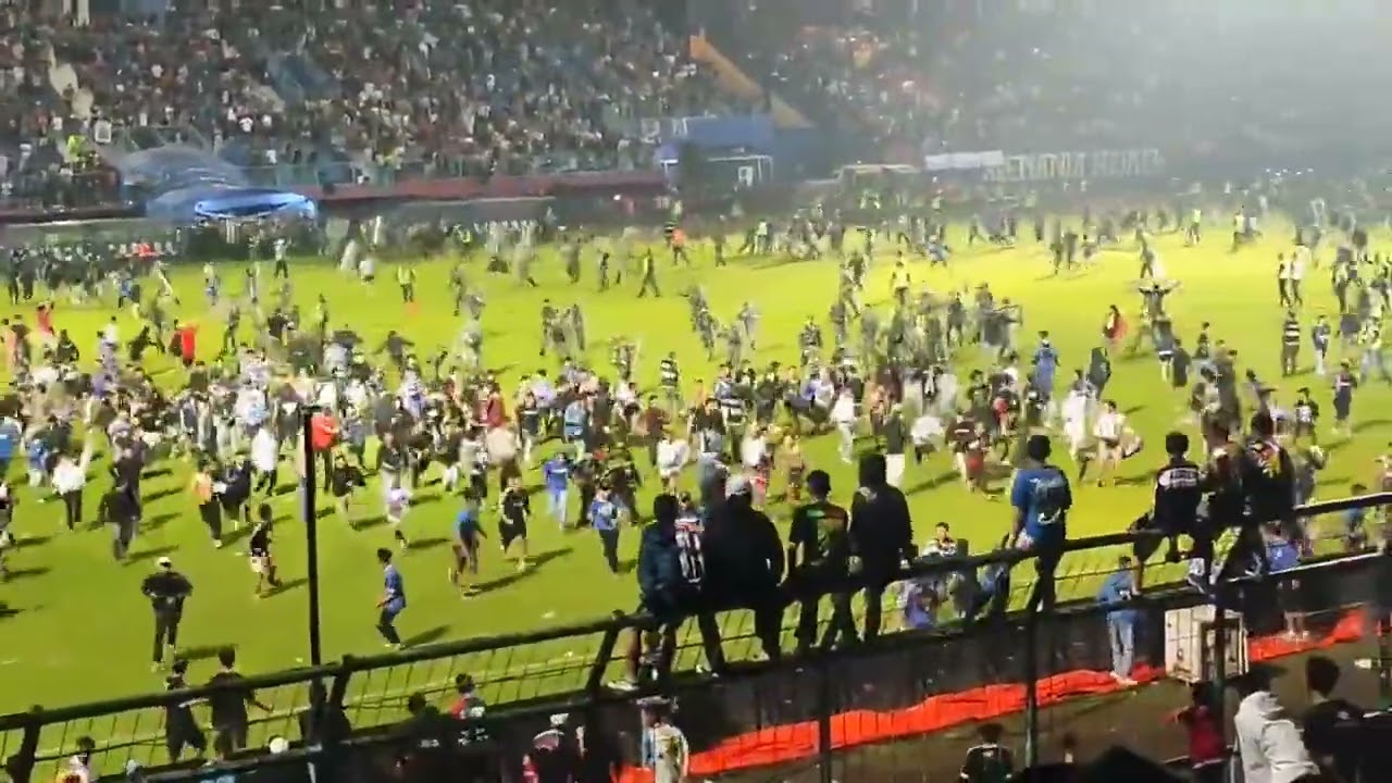 Indonesian stadium brawl during Arema vs Persebaya game at Kanjuruhan Stadium in Malang