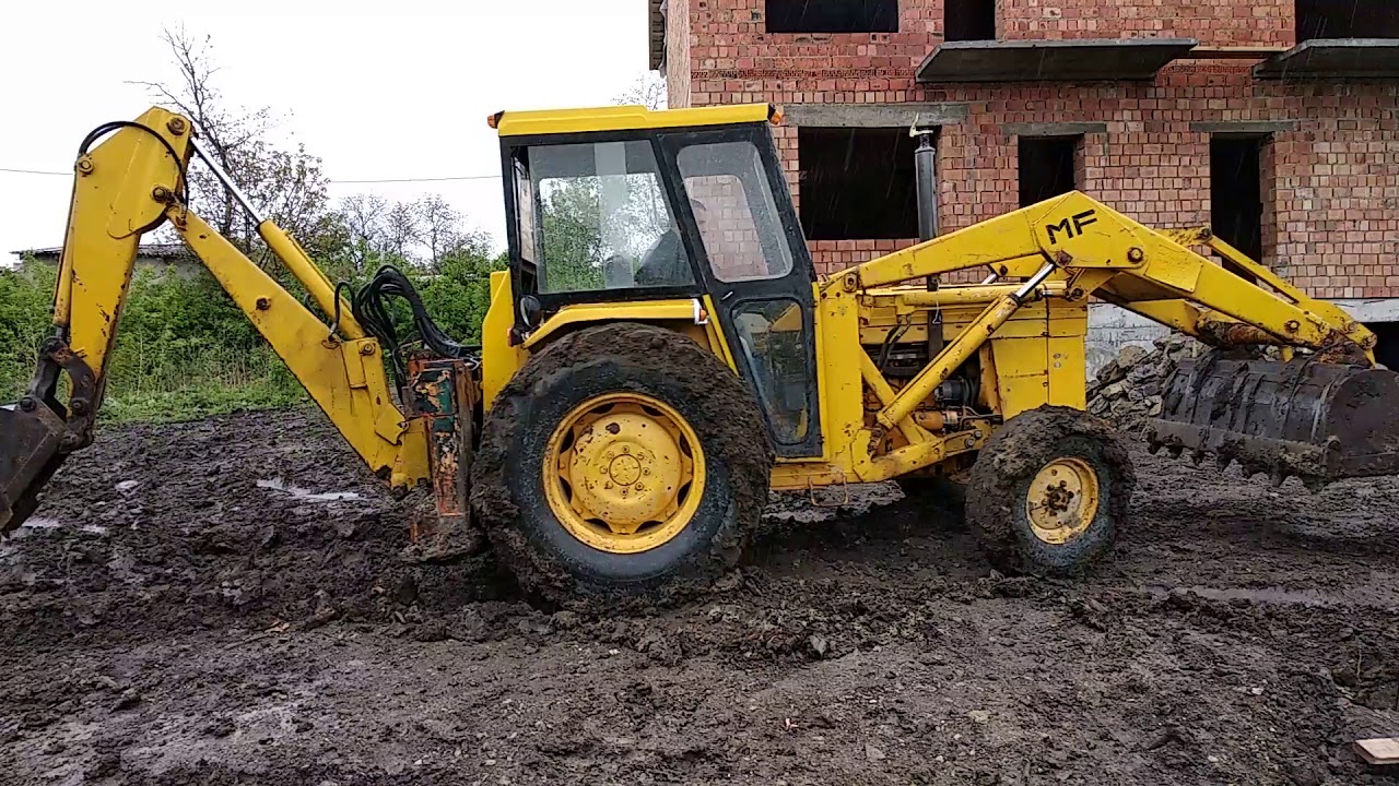 Excavator Mf 50r rescue truck from the mud