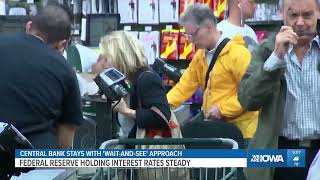 Federal Reserve leaves its key rate unchanged but sees two cuts this year