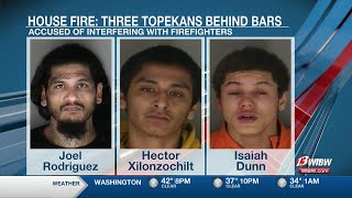 Three arrested after a disturbance at house fire