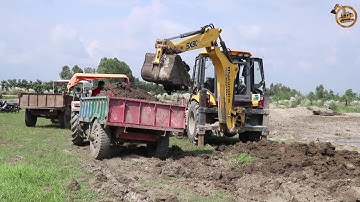 Mahindra Earthmaster SX Backhoe Loader Loading Soil in Swaraj Tractorr - Mahindra Backhoe Video
