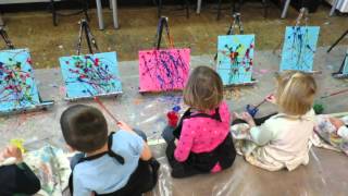 Preschoolers splatter painting Preschoolers splatter painting