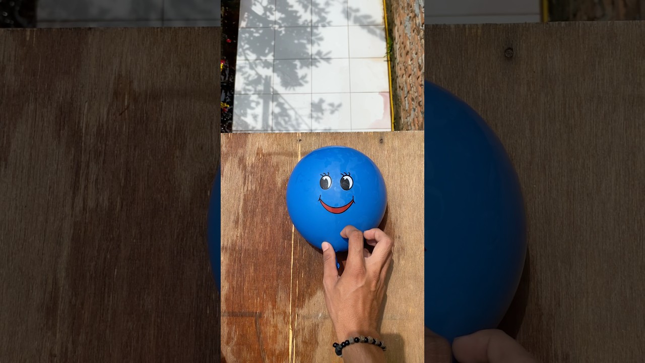 Experiment: Dropping colorful emoji water balloons from a height