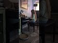 cat enjoying piano lessons