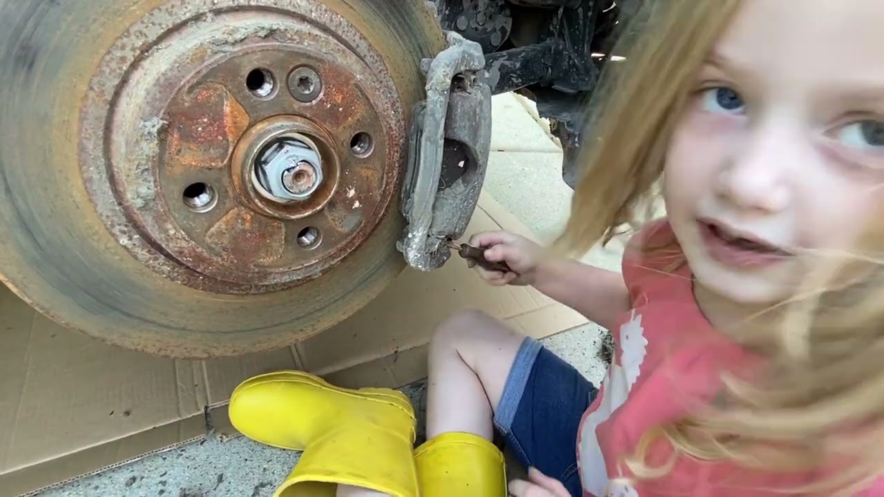 Becca and Dad replace a Mini Cooper Clubman Control Arm - Rachel too.