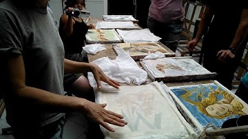 Preparing to detach a fresco onto canvas