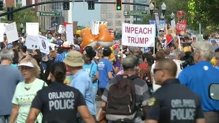 Protesters and 'baby blimp' balloon gather ahead of Trump's re-election launch | AFP As US President Donald Trump heads to Orlando to launch his re-election campaign, protesters and the giant 'baby blimp' position themselves just a few blocks ..., From YouTubeVideos