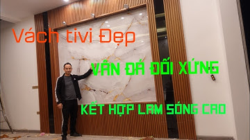 cách thi công mẫu vách tivi đẹp kết hợp tấm nhựa giả vân đá đối xứng pvc và tấm nhựa giả gỗ lam sóng