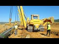 Gas Pipeline Construction - Pipeline Lowering in to the trench in normal terrain.