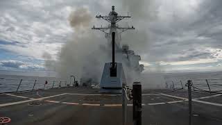 The destroyer USS Thomas Hudner (DDG 116) fires Tomahawk missiles
