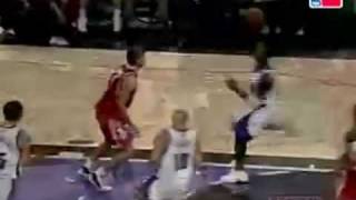 Gerald Wallace flying over Houston's Nachbar for the dunk