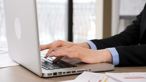 Woman Hands Typing on Laptop Keyboard in the Office | Stock Footage - Videohive