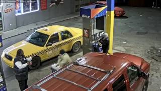 Two armed men caught on video robbing man at Detroit gas station