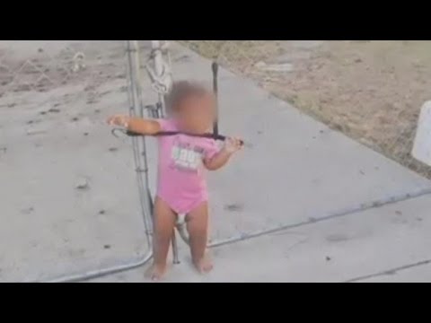 Little Girl Found Tangled and Strapped To Wire Fence By Bungee Cord