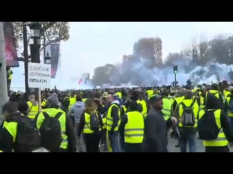 Police fire tear gas at yellow vest protesters in Paris