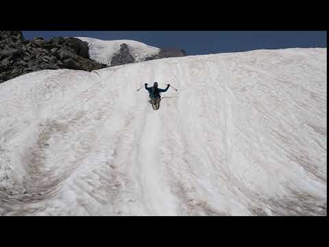 Tom sliding down Muir Snowfield