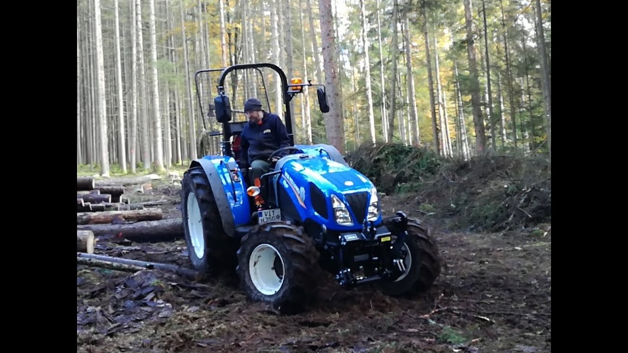 New Holland TD3 50  und T4 85 bei der Holzarbeit