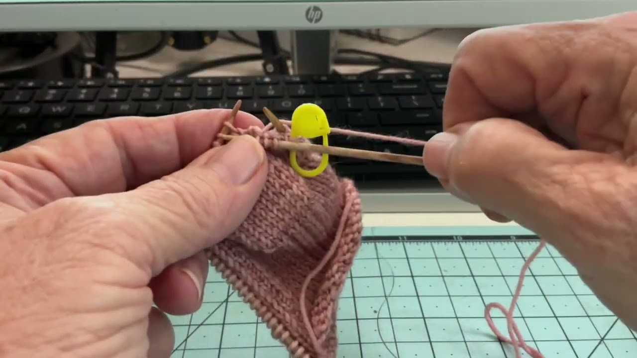 Knitting of a sock, decreases around the gusset area