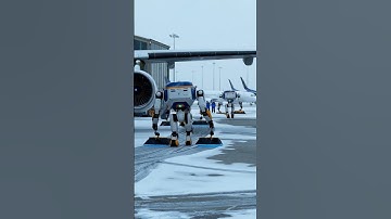 FUTURE ROBOTS TAKING CARE OF ICY AIRPORT RUNWAY.