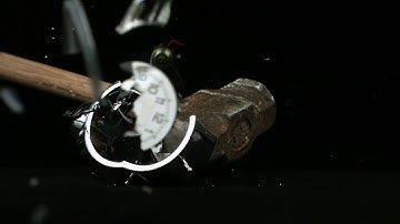 slow motion smashing alarm clock with sledgehammer wy9wf7ver  D