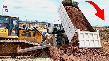 Great action Team Dump truck Waiting unloading soil with Stone Land Filling Up Dozer working part22