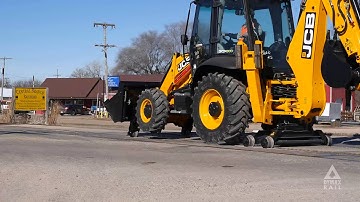 JCB 3CX-14 Super Backhoe Loader with the DYMAX Rail Rider Attachment Package