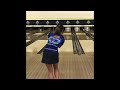 2 handed girl throws it really good and strike