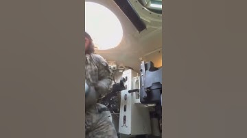 Artillery Soldier loading massive Tank Shell in confined space.