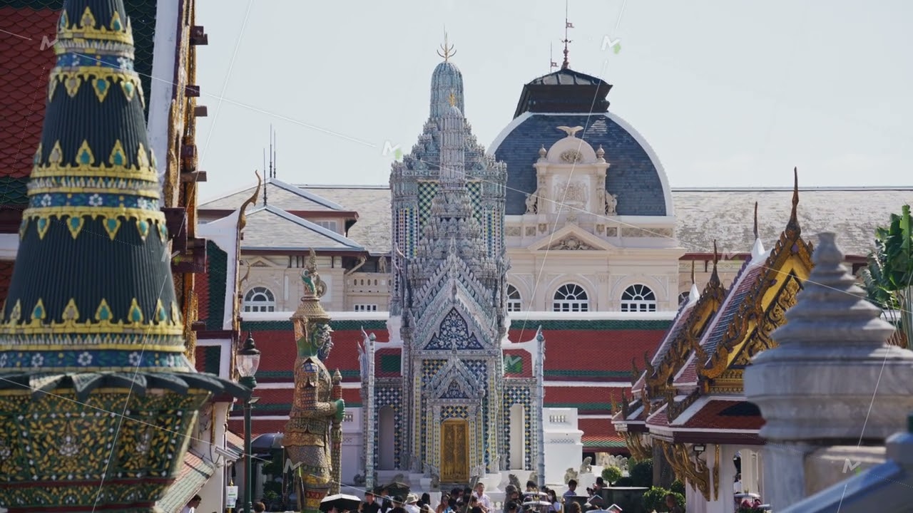 Intricate details of Grand Palace and Wat Phra Kaew in Bangkok, Thailand. Tourists visit historic