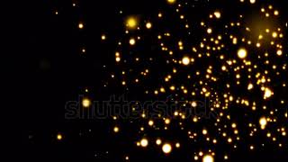 stock footage glittering particles sparkle and drift along on a soft current gold particles