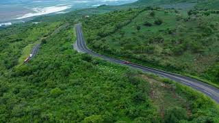 Curvy road on a tree covered hill | Road Stock Footage