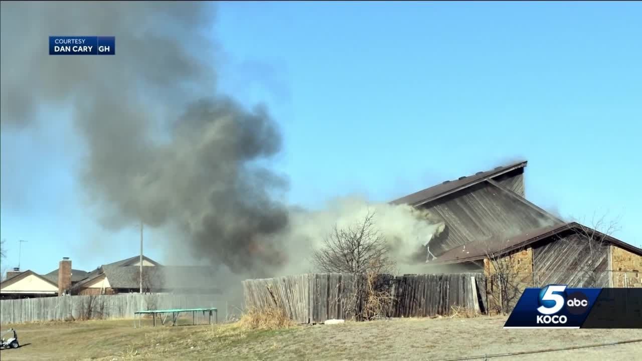 Crews battle house fire in northeast Norman - YouTube