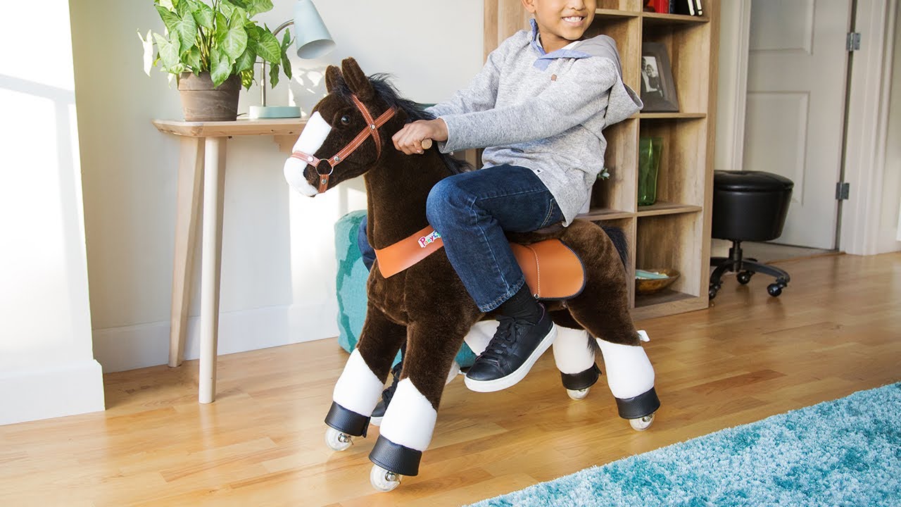 sit on plush horse