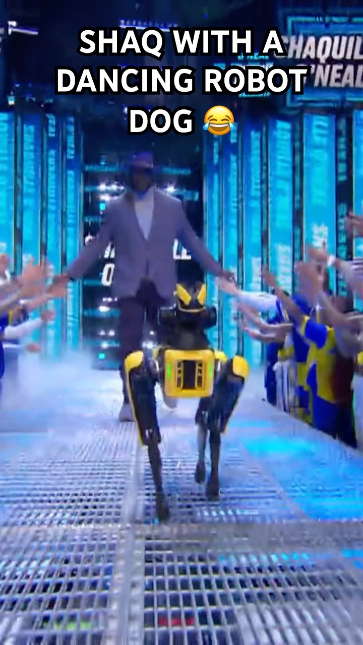 Shaq gets escorted out by a dancing robotic dog ?