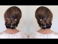 Learn this smooth and sleek twisted low bun.