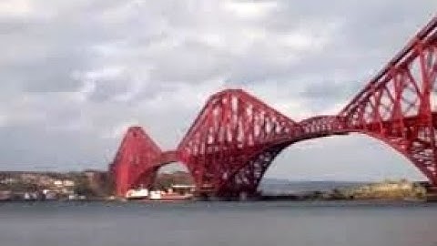 Winter Ship Sailing Under Forth Railway Bridge On History Visit To Firth Of Forth Scotland