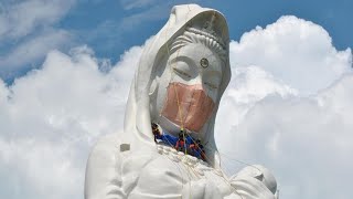 Giant Buddhist goddess gets face mask