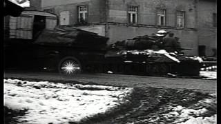 99th Division dig foxhole, armored vehicles pass and Major General Leonard T Gero...HD Stock Footage
