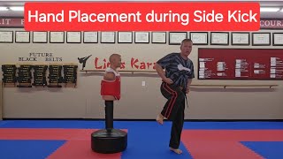 Where do you hands go during a side kick - placement