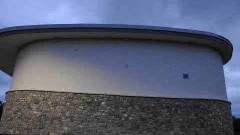Swifts flying past and entering built-in nest boxes at Castlebar Leisure Centre in Co. Mayo, 2020