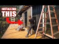 Couple struggles installing huge sliding glass doors diy building