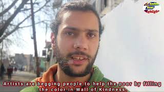 Artists are begging people to help the poor by filling the color in wall of Kindness..