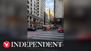 Suspect takes forklift for joy ride in downtown Los Angeles before crashing into theatre