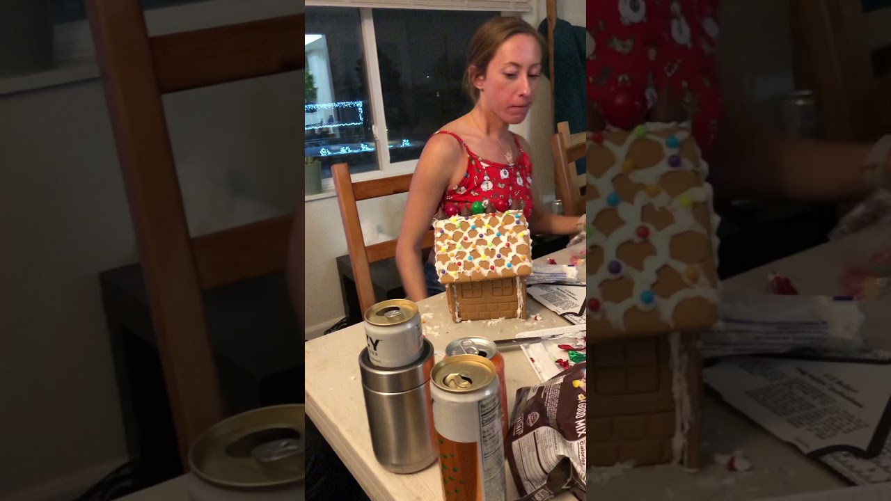 Girl smashing gingerbread house with head - ORIGINAL