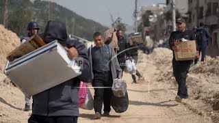 Palestinians in West Bank refugee camp grab belongings ahead of demolition of homes by Israel