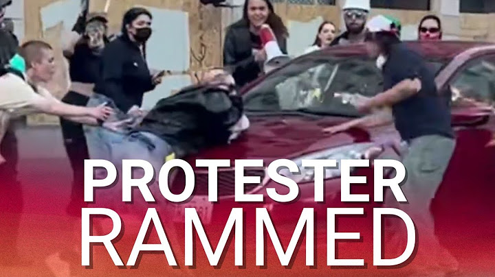 Protester run over by moving car as fed-up LA drivers have had enough of disruptive riots