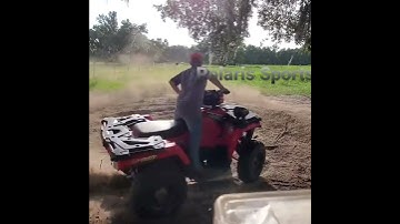 Polaris Sportsman doing  Donuts