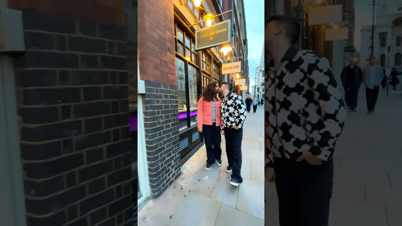 Gay couple kissing on the street 