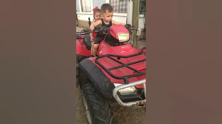 My 3 year old riding a quad