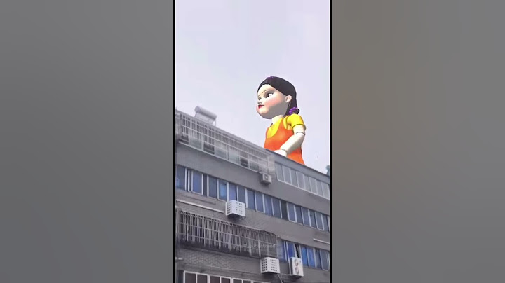 GIANT DOLL KOKOLA SQUID GAME WALKS AROUND IN THE CITY